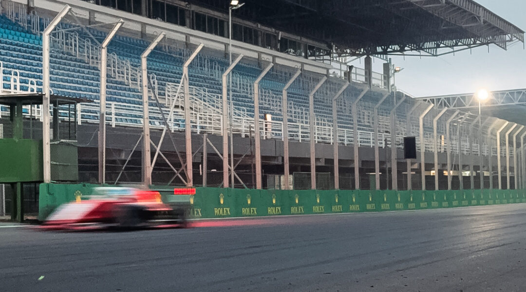 A Formula 1 car speeding past the grandstands at the silverstone 2026 race track.