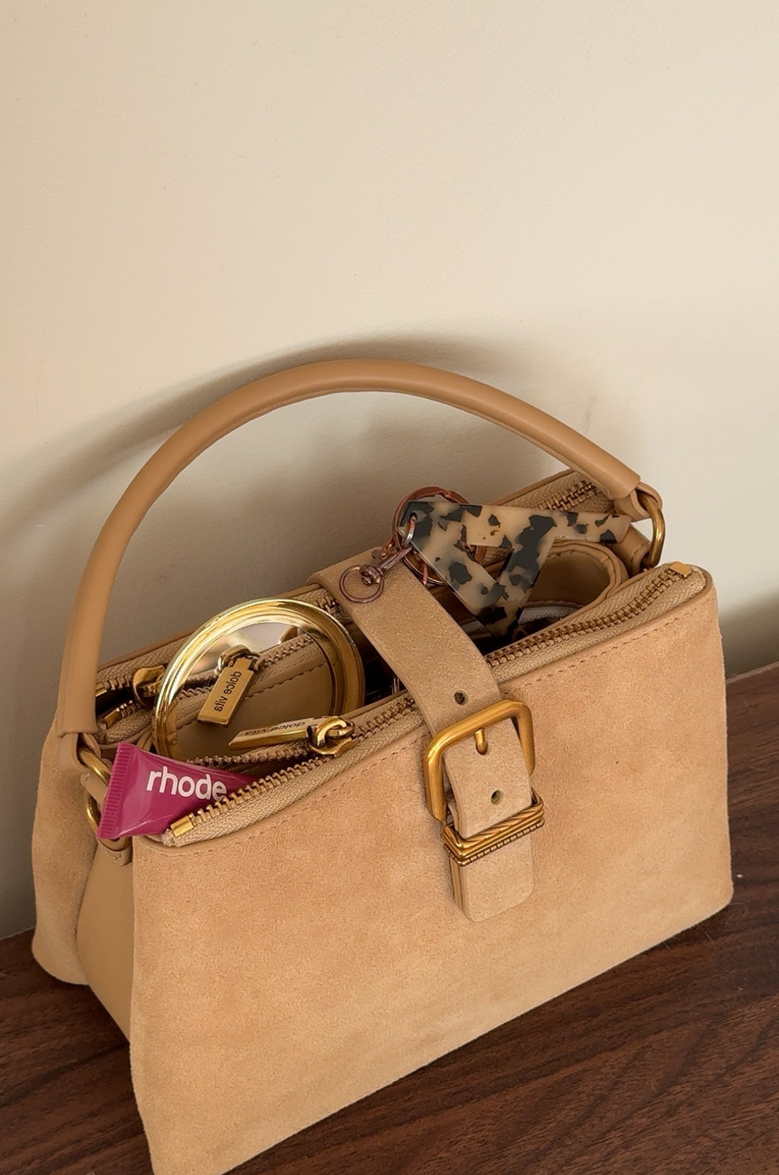 Premium suede handbag highlighting seasonal texture trends Fall 2026