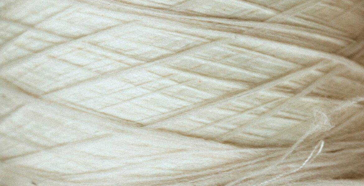 Luxury natural fabrics including linen, silk, cashmere, and fine woven textiles showcasing exceptional craftsmanship.