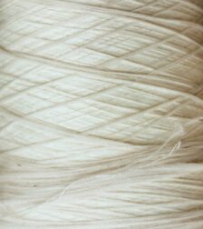 Luxury natural fabrics including linen, silk, cashmere, and fine woven textiles showcasing exceptional craftsmanship.