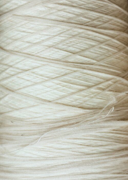 Luxury natural fabrics including linen, silk, cashmere, and fine woven textiles showcasing exceptional craftsmanship.