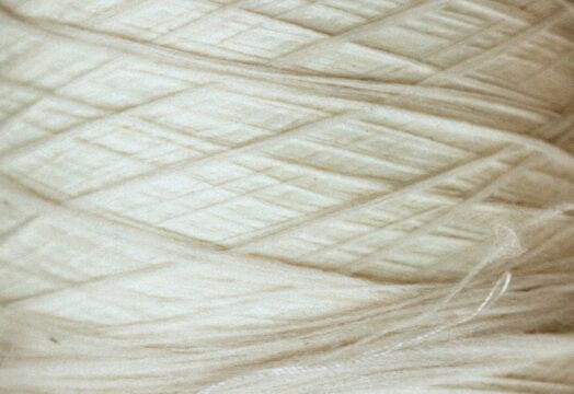 Luxury natural fabrics including linen, silk, cashmere, and fine woven textiles showcasing exceptional craftsmanship.