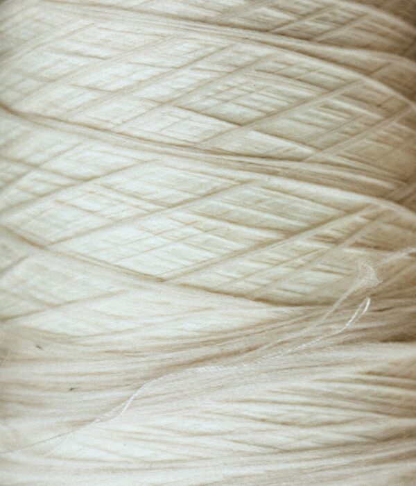 Luxury natural fabrics including linen, silk, cashmere, and fine woven textiles showcasing exceptional craftsmanship.