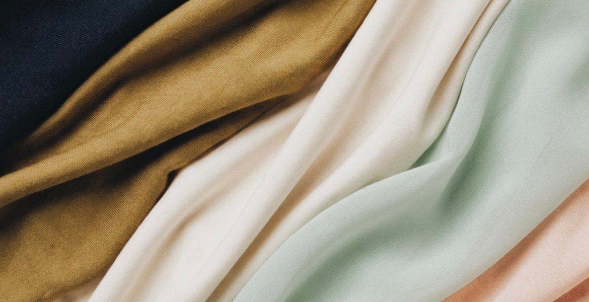 Best hijab fabric comparison with jersey modal chiffon and silk hijabs Jersey hijab styled for everyday modest fashion Modal hijab in neutral tones with elegant drape